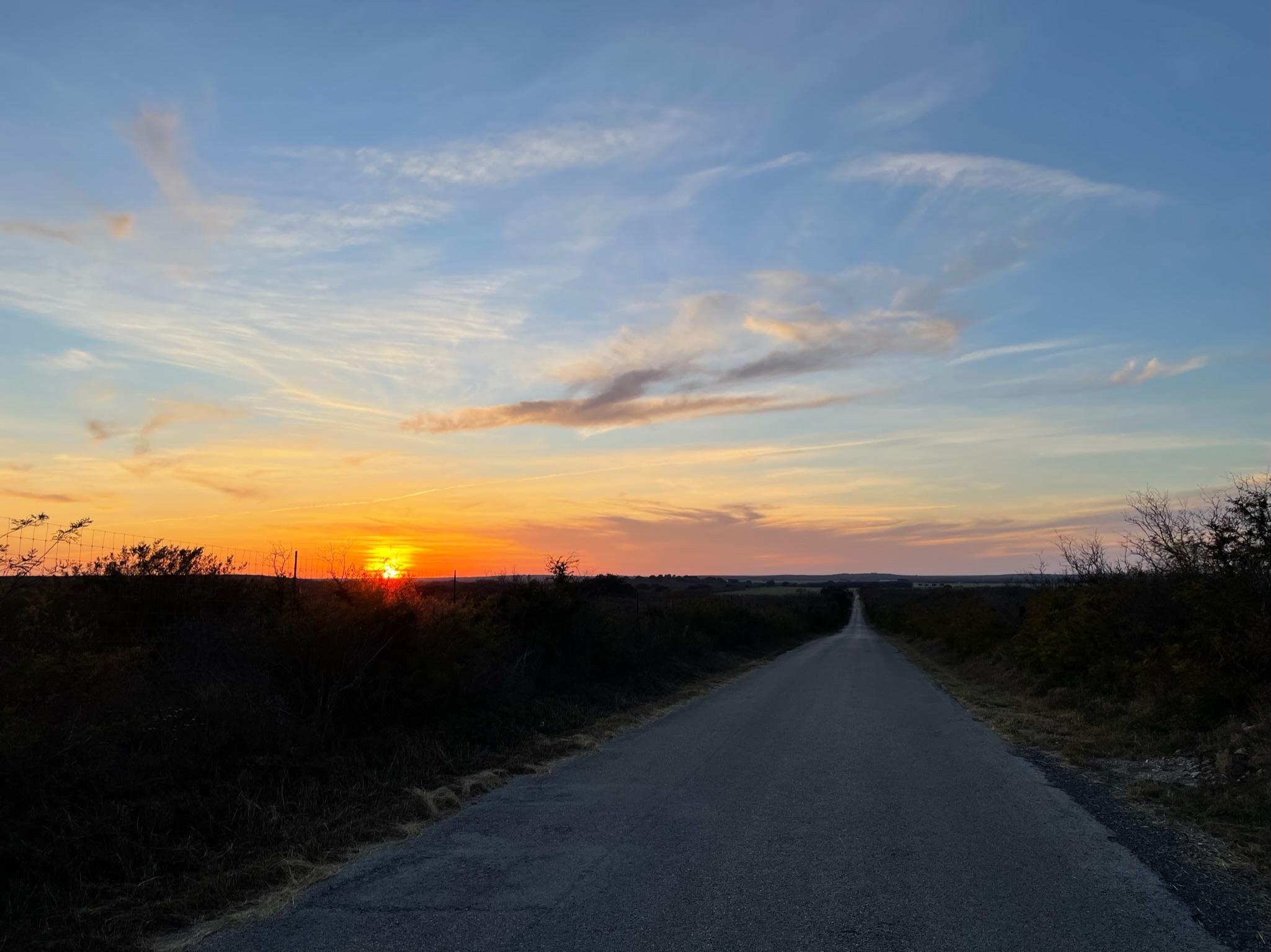 Rural county road at sunset.